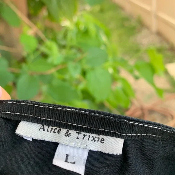 Black dress with white stitching. - Picture 3 of 5